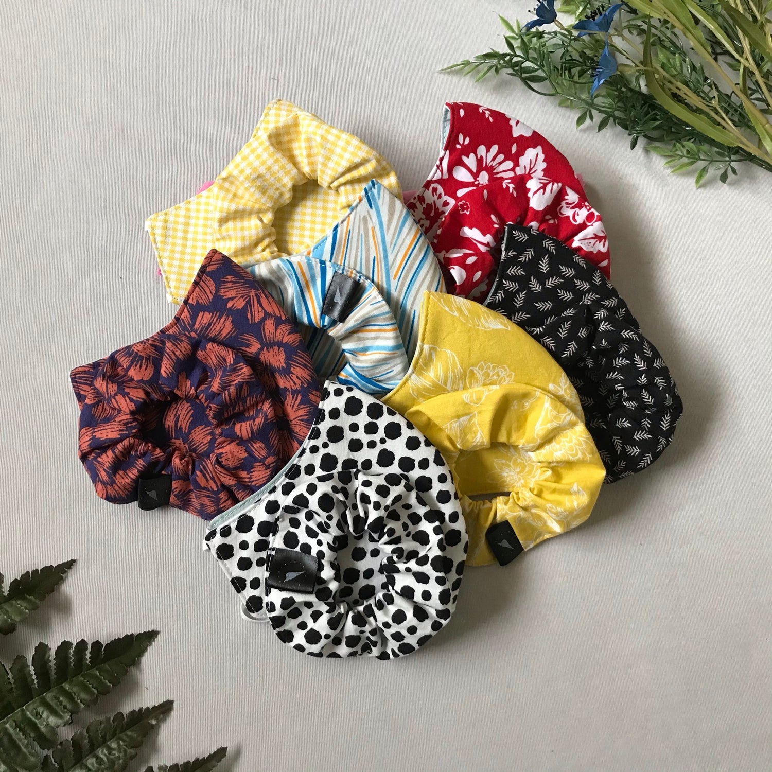 assortment of bright coloured masks with matching scrunchies