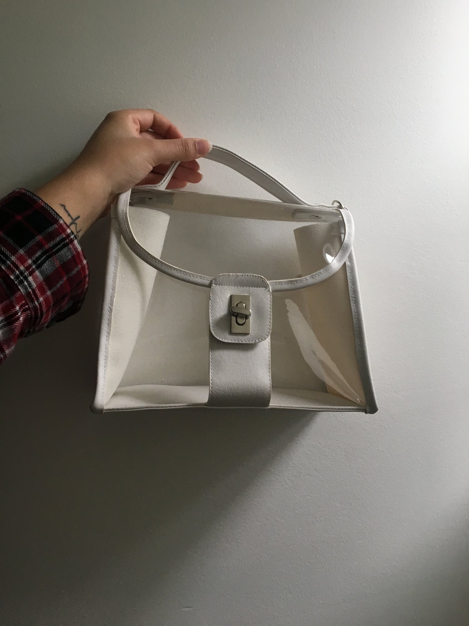 translucent small purse with white leather trim