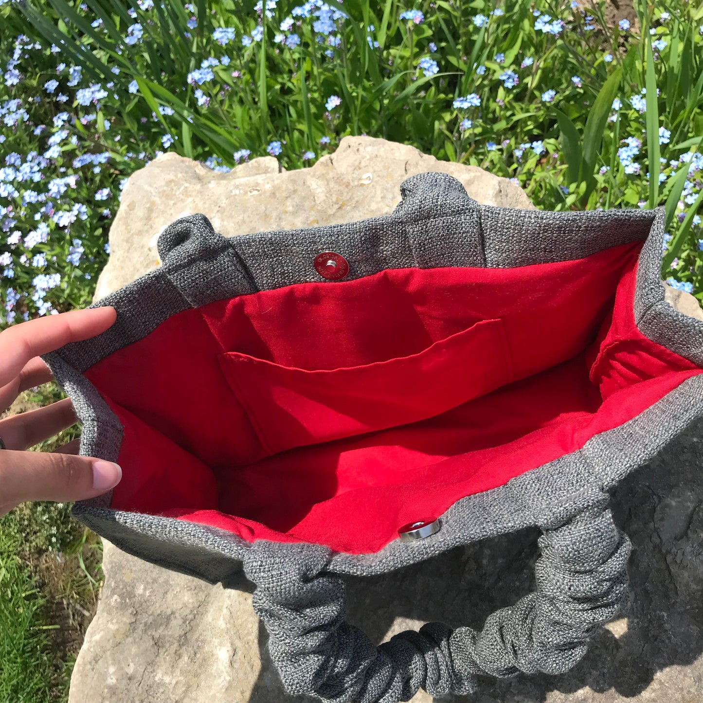 grey red scrunchie bag inside